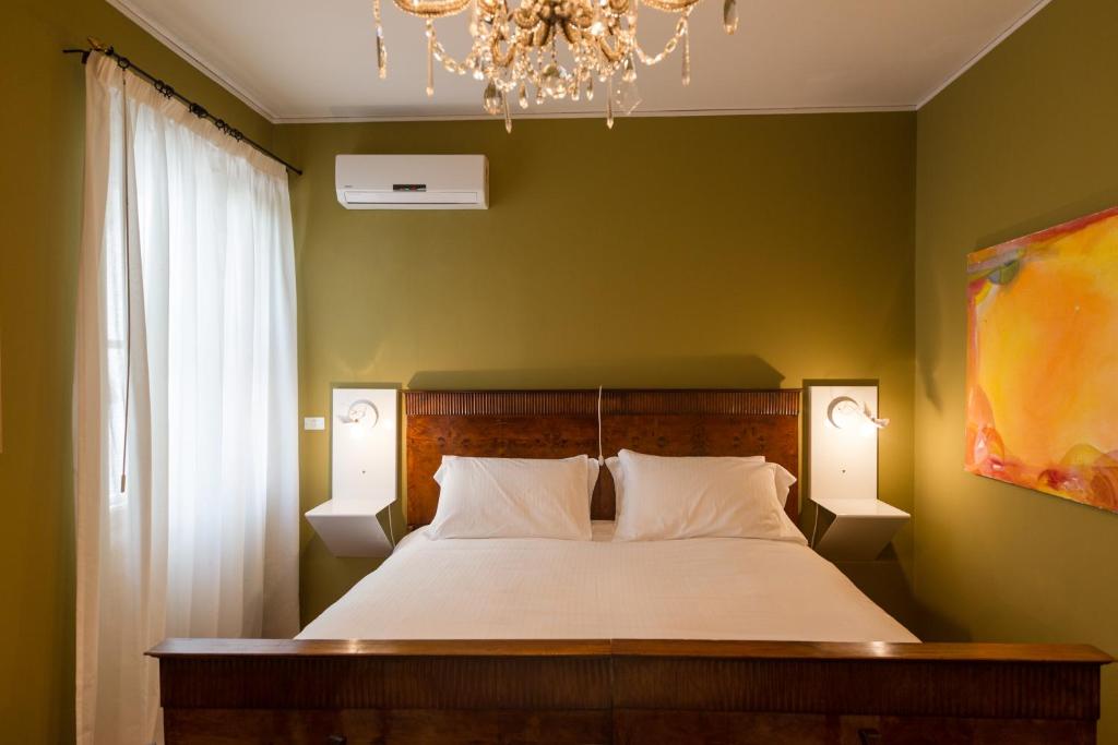 Postel nebo postele na pokoji v ubytování Palazzo Fracastoro