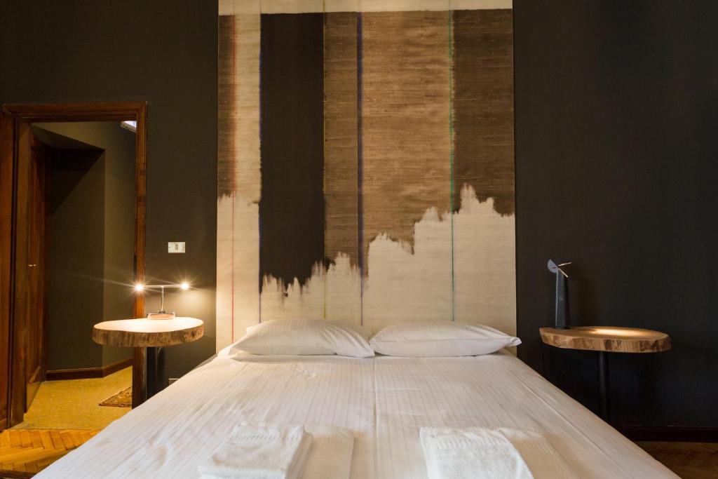Postel nebo postele na pokoji v ubytování Palazzo Fracastoro