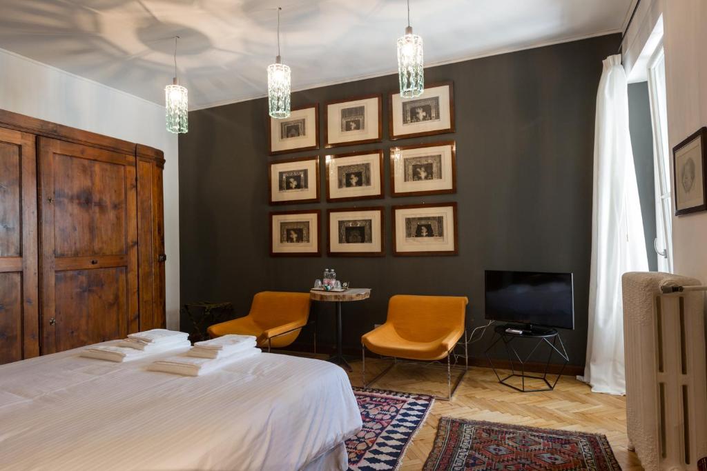 Postel nebo postele na pokoji v ubytování Palazzo Fracastoro