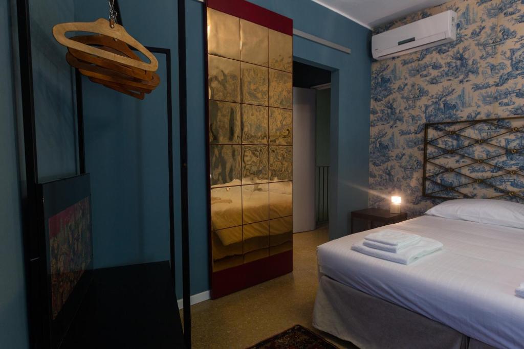 Postel nebo postele na pokoji v ubytování Palazzo Fracastoro