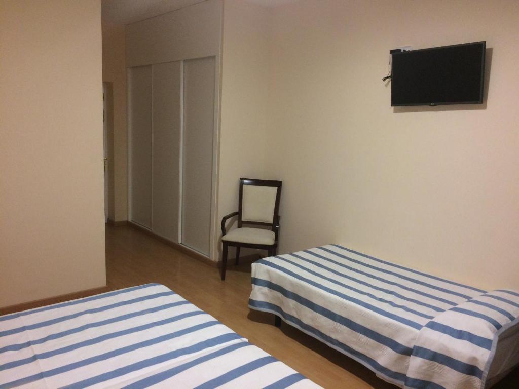 Postel nebo postele na pokoji v ubytování Hotel Castillo