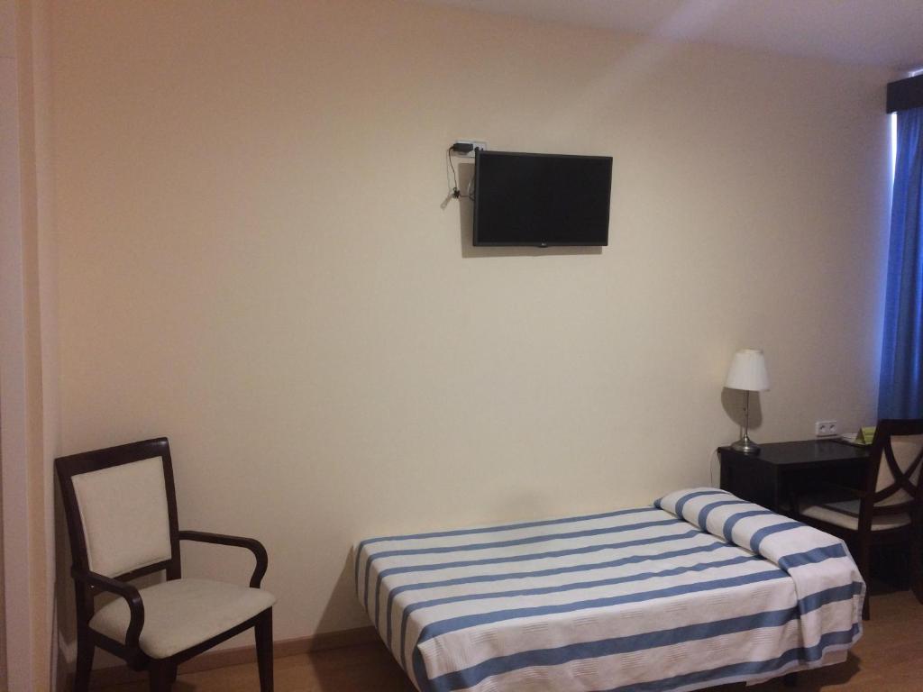 TV a/nebo společenská místnost v ubytování Hotel Castillo