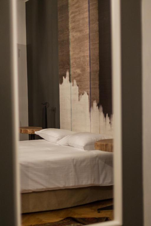 Postel nebo postele na pokoji v ubytování Palazzo Fracastoro