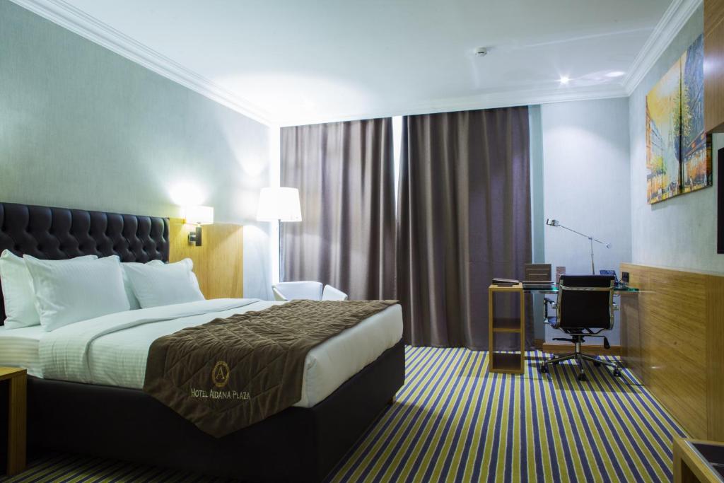 Postel nebo postele na pokoji v ubytování Aidana Plaza Hotel