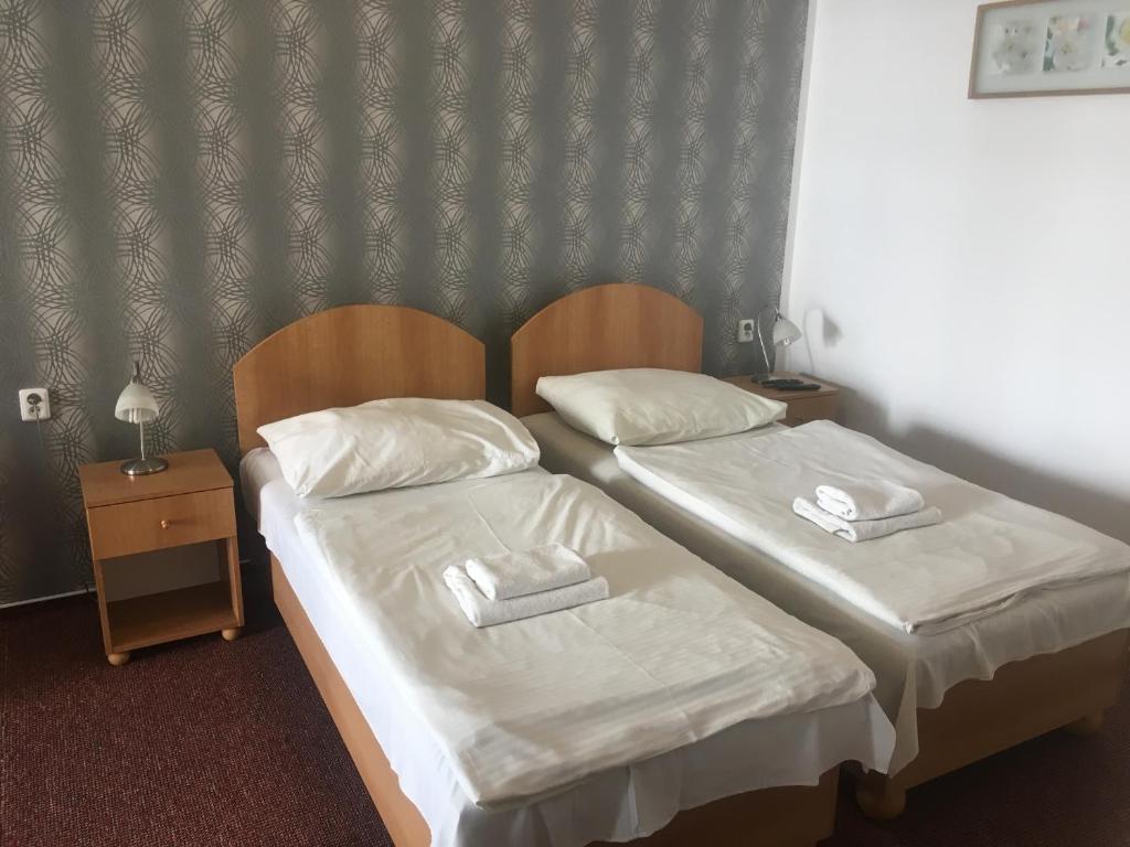 Postel nebo postele na pokoji v ubytování Hotel City