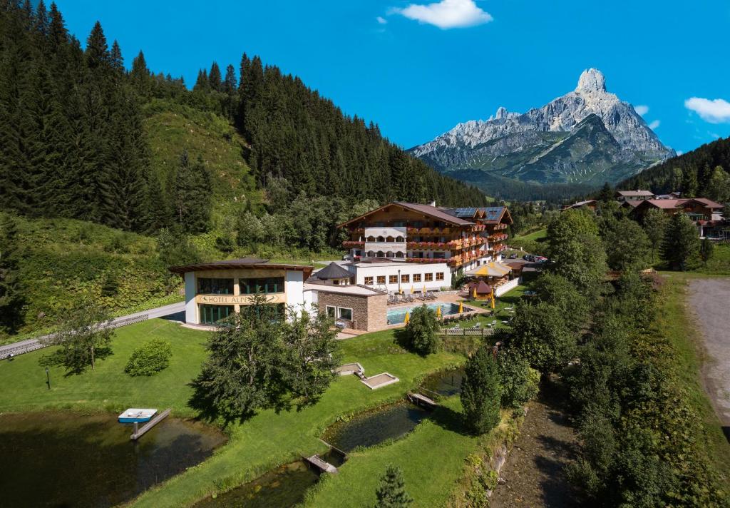 an aerial view of a resort in the mountains at Landhotel Alpenhof Filzmoos in Filzmoos