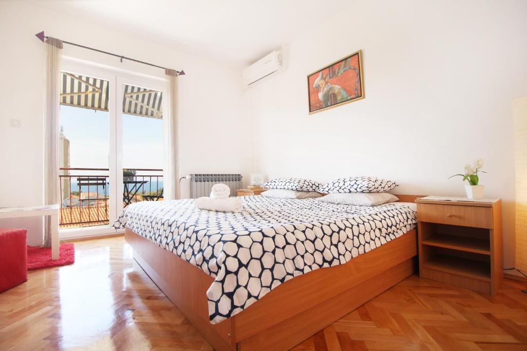 Postel nebo postele na pokoji v ubytování Guesthouse Marta