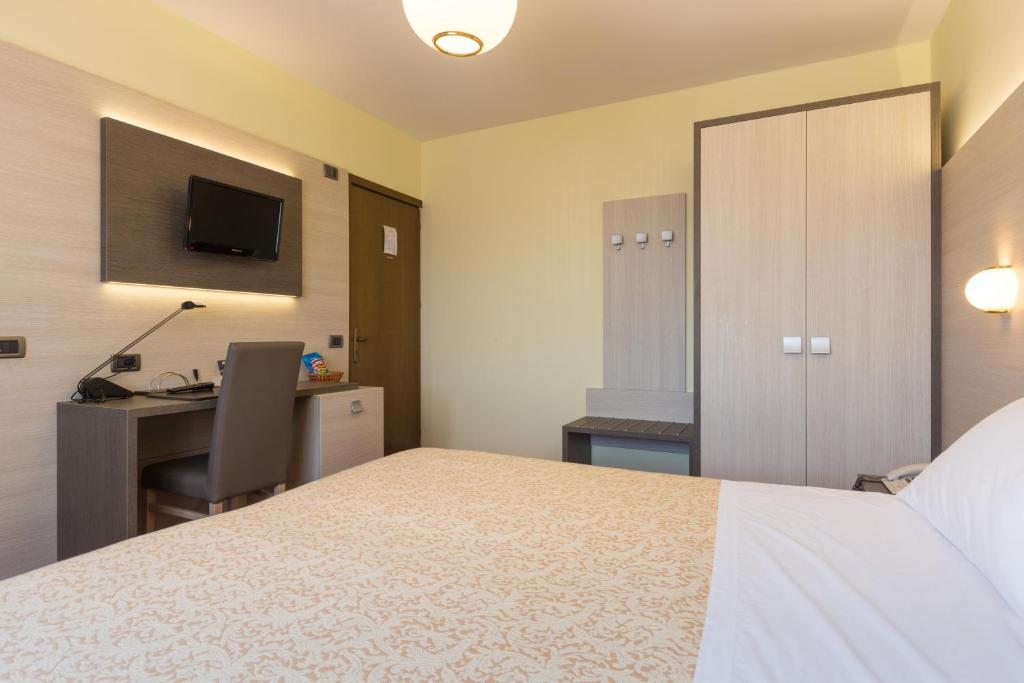 Postel nebo postele na pokoji v ubytování Park Hotel Ristorante Ca' Bianca
