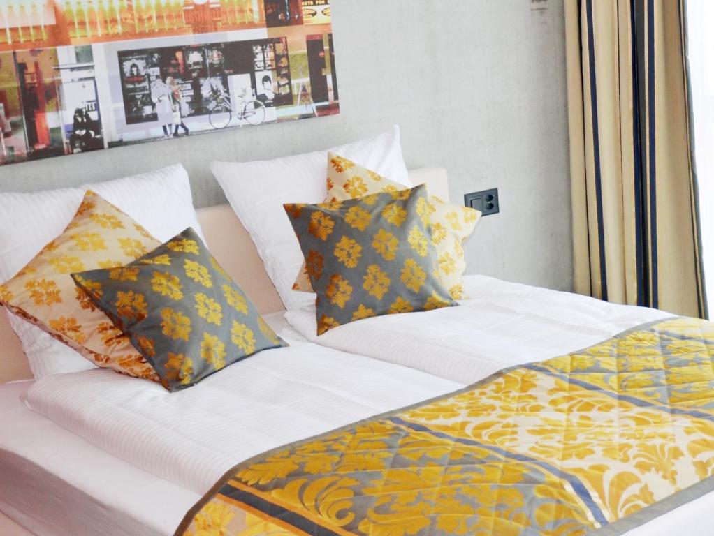 Postel nebo postele na pokoji v ubytování Hotel Swiss Star