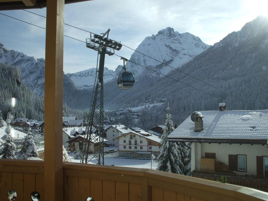 a view of a ski resort with a ski lift at La Campagnola in Canazei