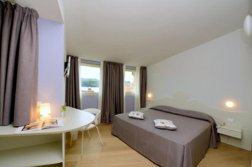 Postelja oz. postelje v sobi nastanitve Aromi Piccolo Hotel