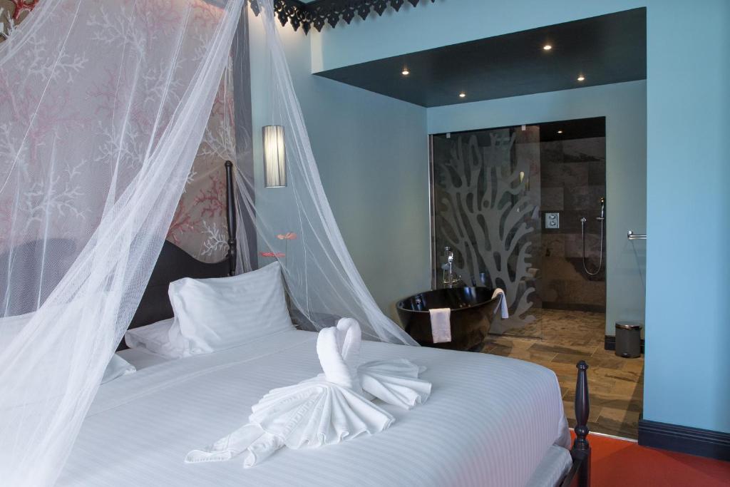 Postel nebo postele na pokoji v ubytování Villa Delisle Hôtel & Spa