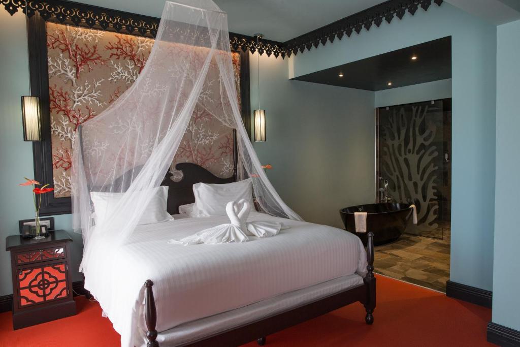 Postel nebo postele na pokoji v ubytování Villa Delisle Hôtel & Spa