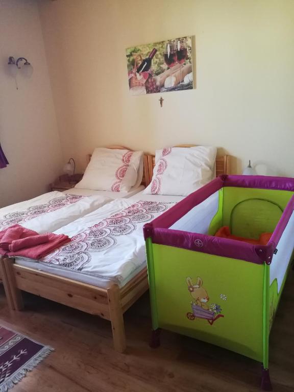 Postel nebo postele na pokoji v ubytování Vitis Vendégház