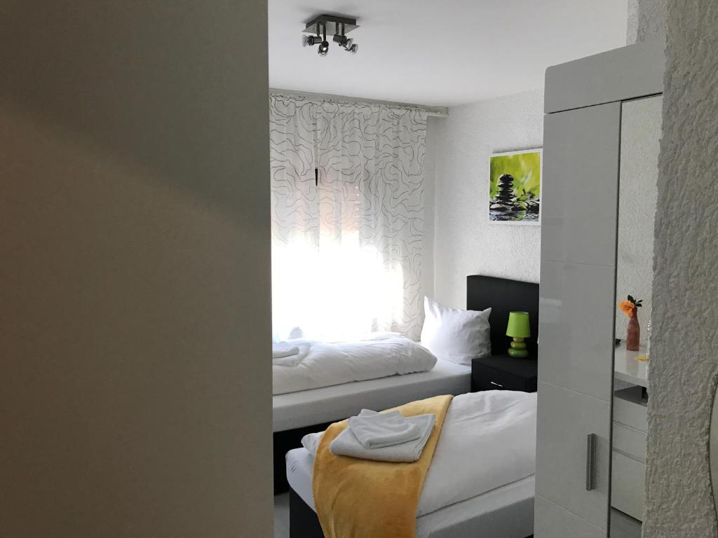 Postel nebo postele na pokoji v ubytování Hotel Berlin