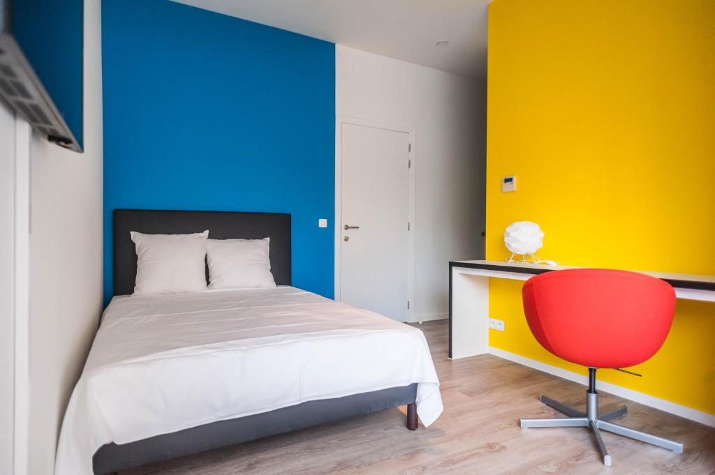 En eller flere senge i et værelse på Ooostel2.be Leuven