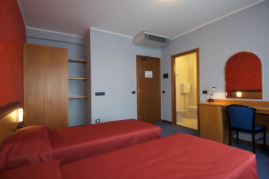 Postel nebo postele na pokoji v ubytování Hotel Residence Ducale