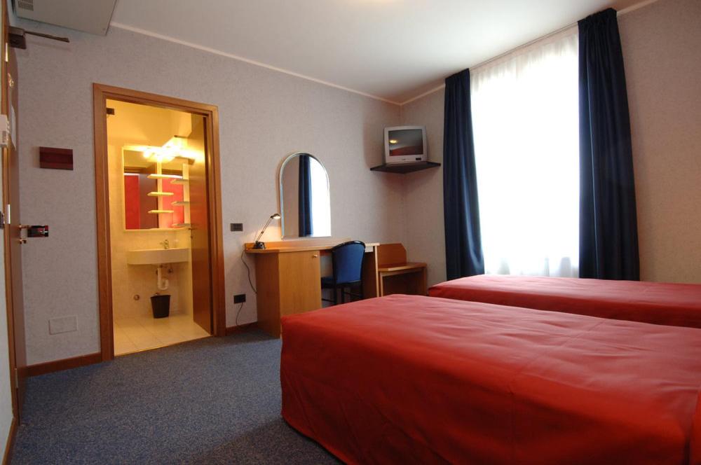 Postel nebo postele na pokoji v ubytování Hotel Residence Ducale