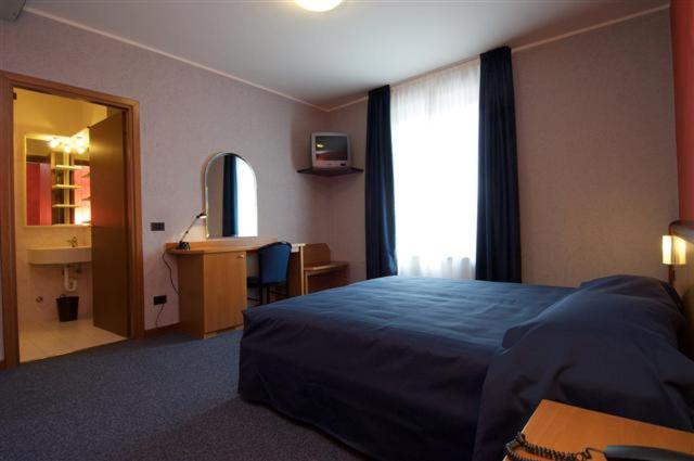 Postel nebo postele na pokoji v ubytování Hotel Residence Ducale