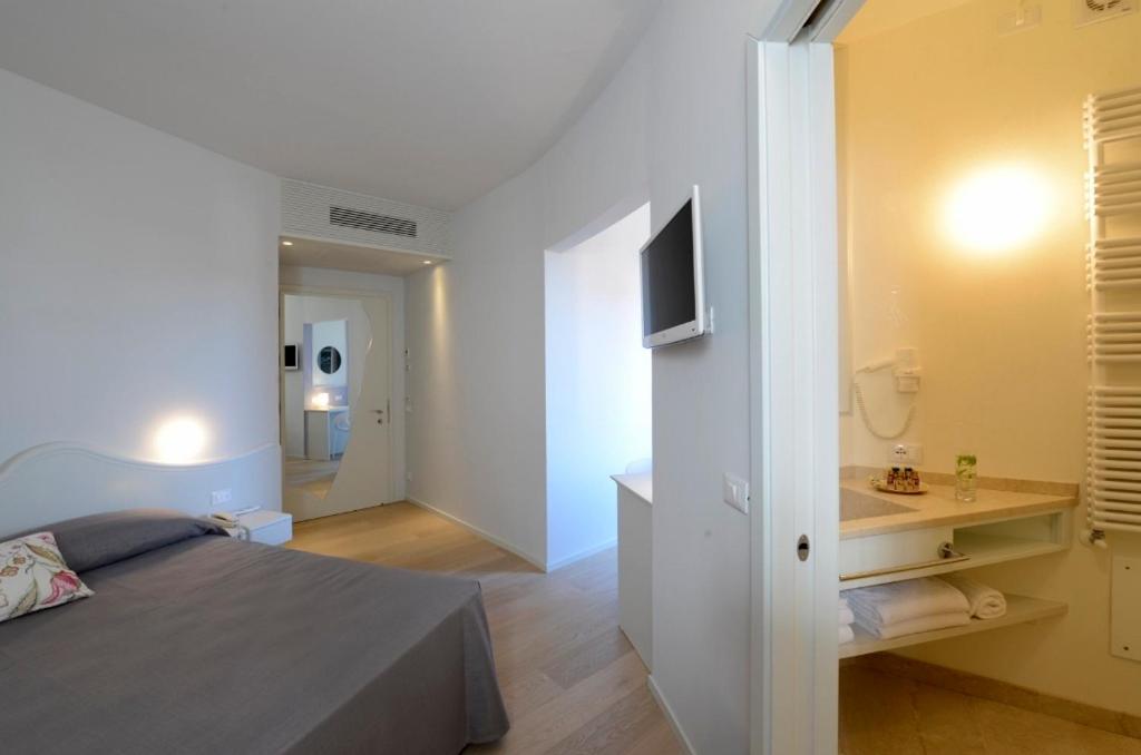 Postelja oz. postelje v sobi nastanitve Aromi Piccolo Hotel