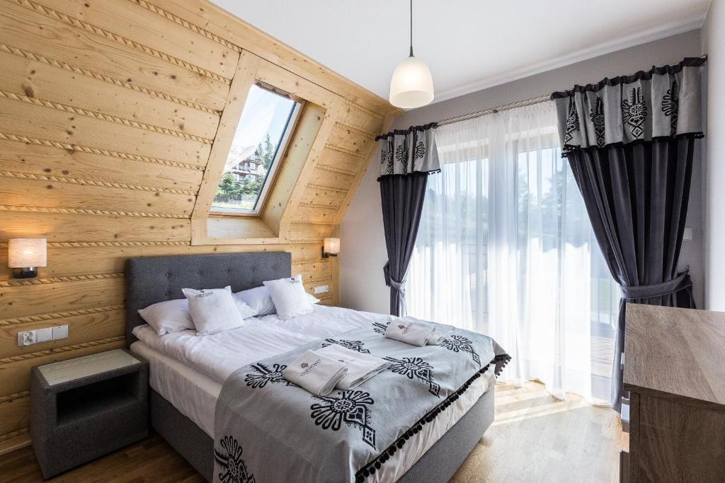 Posteľ alebo postele v izbe v ubytovaní Giewont Residence