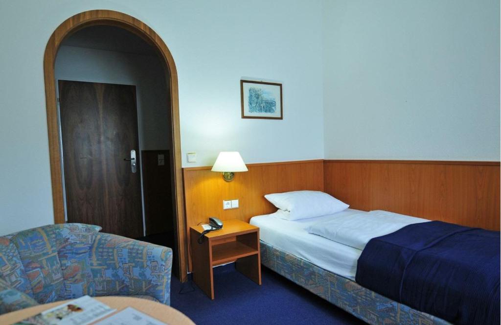 Postel nebo postele na pokoji v ubytování Hotel Haus Reichert