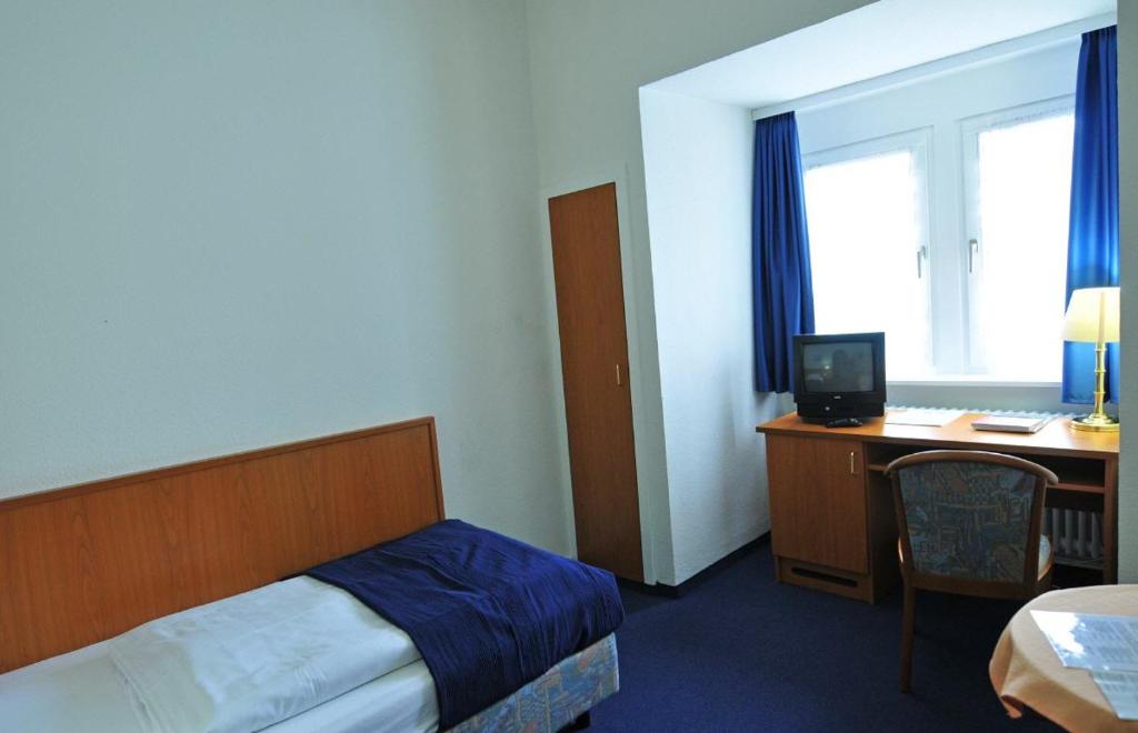 Postel nebo postele na pokoji v ubytování Hotel Haus Reichert