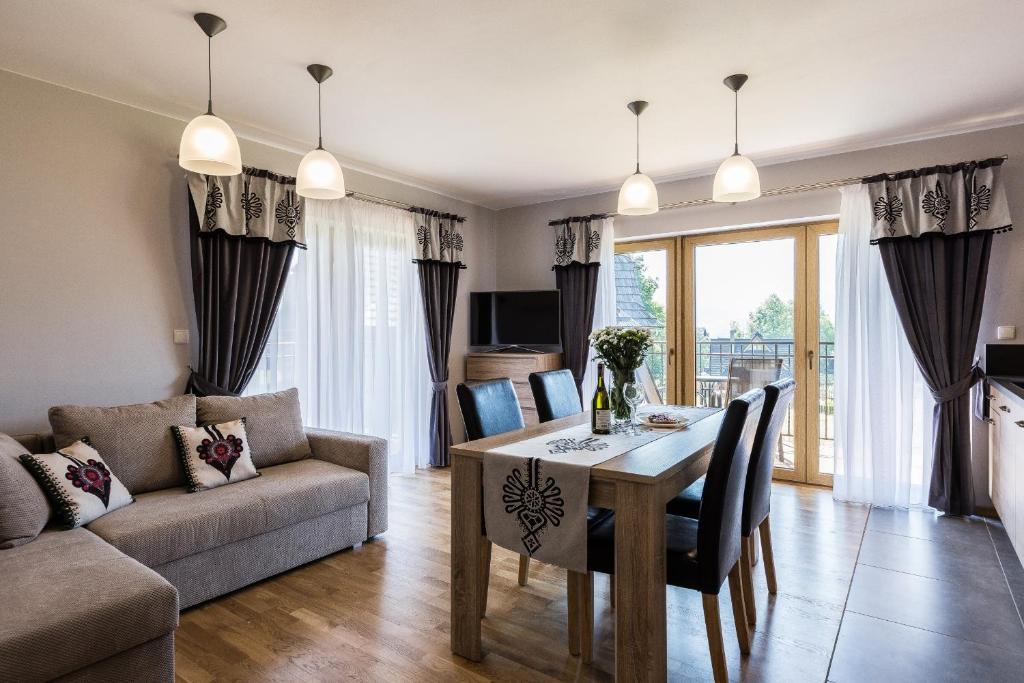 Televízia a/alebo spoločenská miestnosť v ubytovaní Giewont Residence