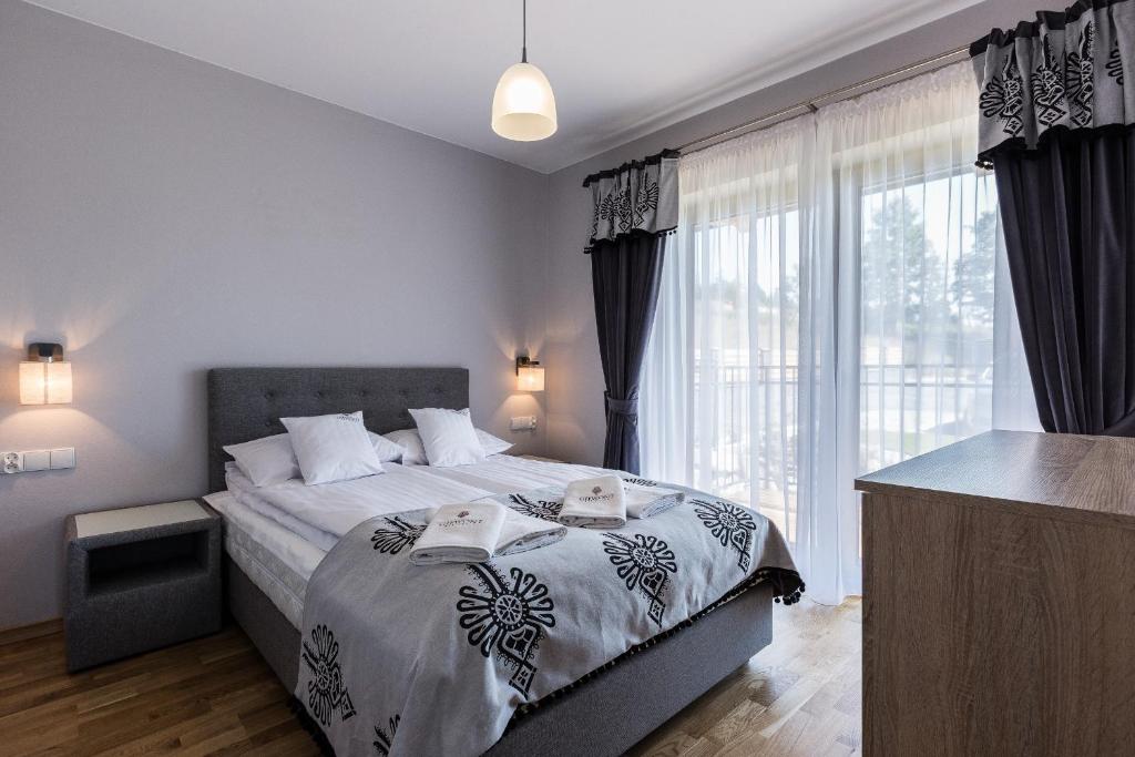 Posteľ alebo postele v izbe v ubytovaní Giewont Residence