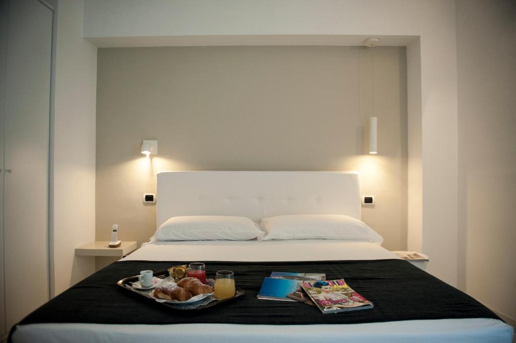 Кровать или кровати в номере Hotel Villa Felice Relais