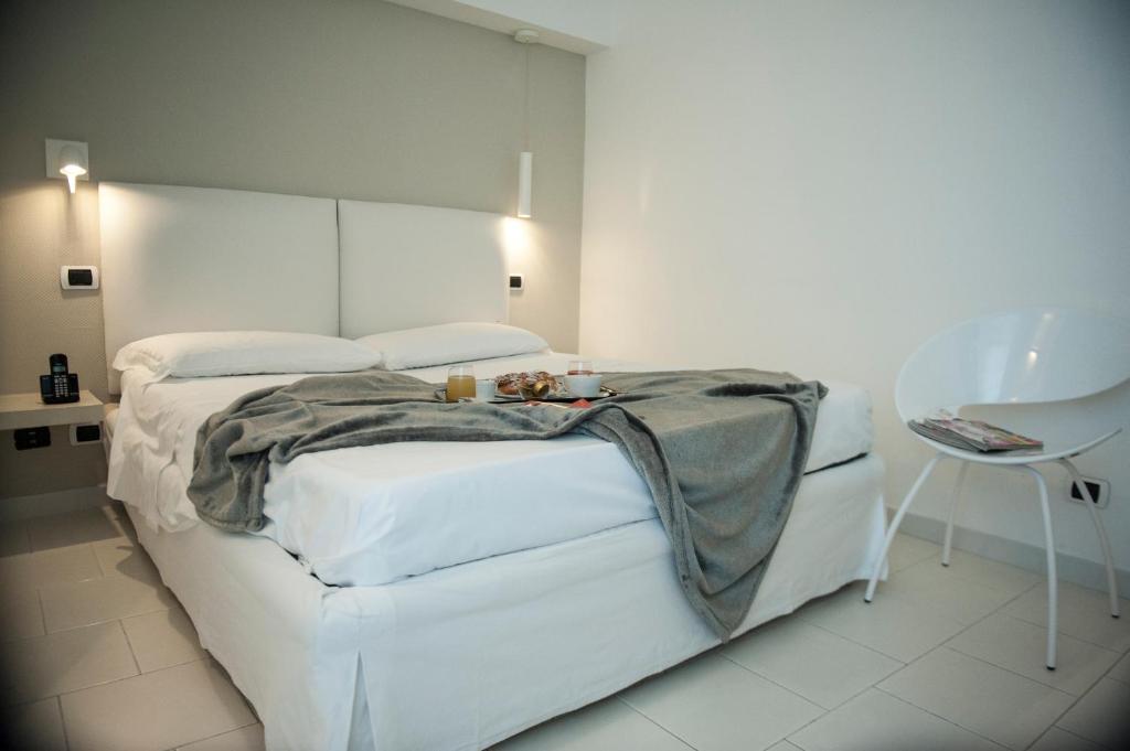Кровать или кровати в номере Hotel Villa Felice Relais