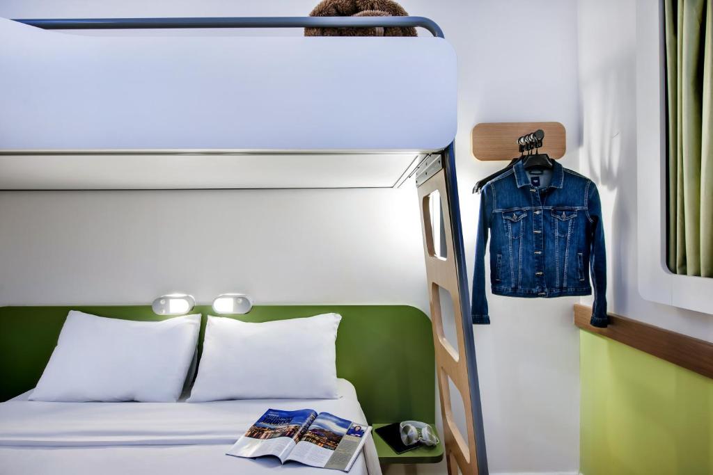 Postel nebo postele na pokoji v ubytování ibis budget Porto Alegre