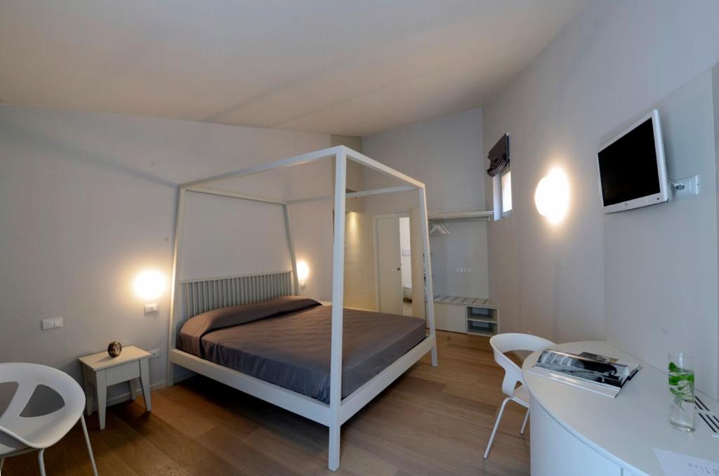 Postelja oz. postelje v sobi nastanitve Aromi Piccolo Hotel