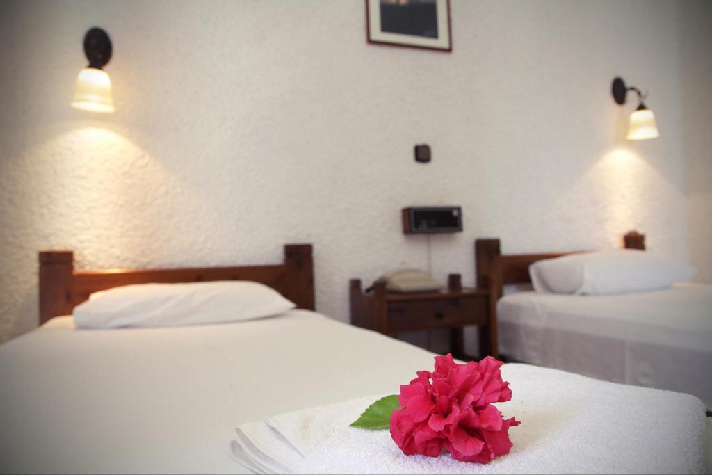 Łóżko lub łóżka w pokoju w obiekcie Delfini Apartments