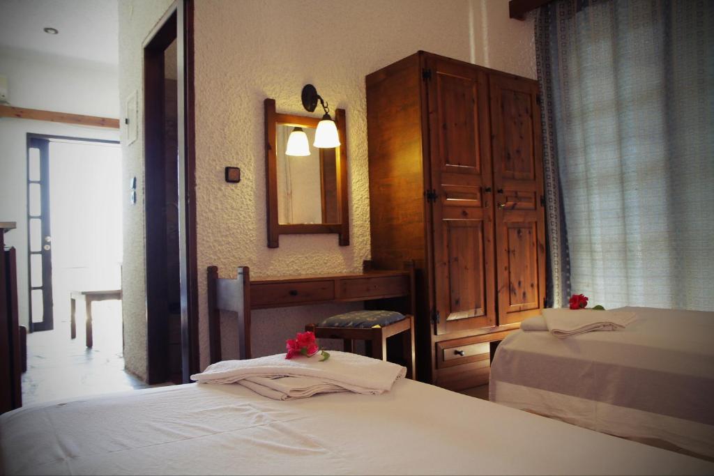 Łóżko lub łóżka w pokoju w obiekcie Delfini Apartments