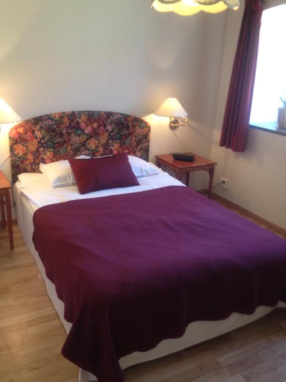 Postel nebo postele na pokoji v ubytování Hotel Chaplin