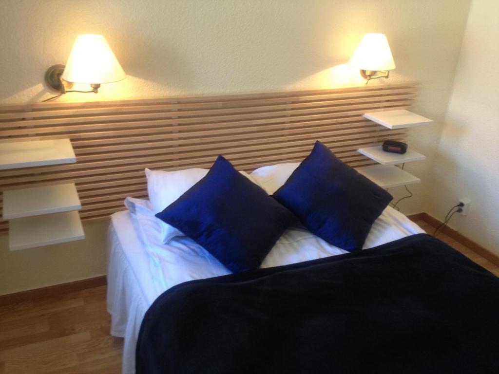 Postel nebo postele na pokoji v ubytování Hotel Chaplin