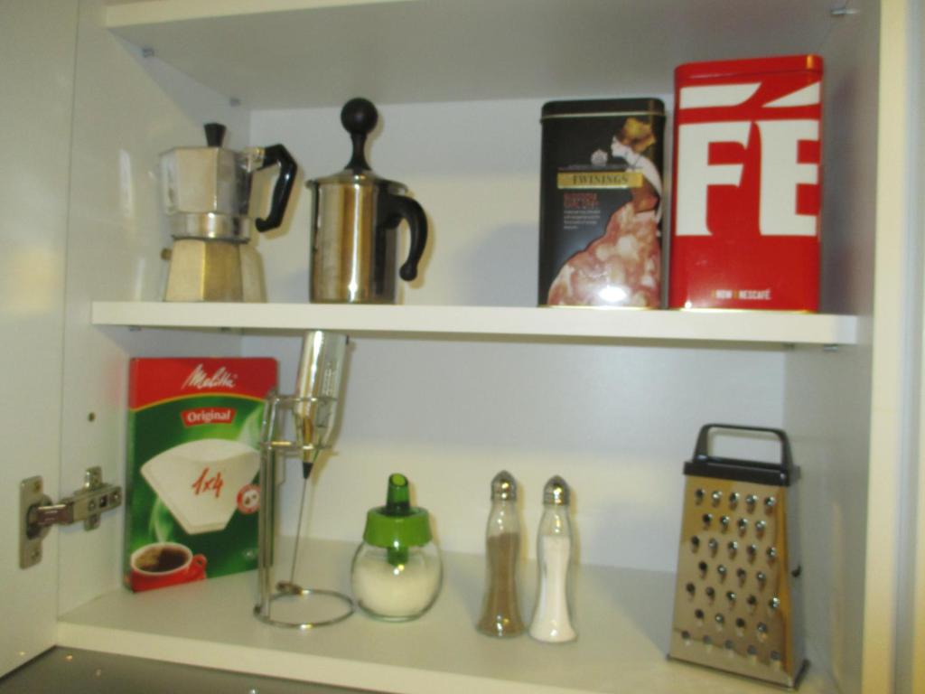 A kitchen or kitchenette at Genex Apartment