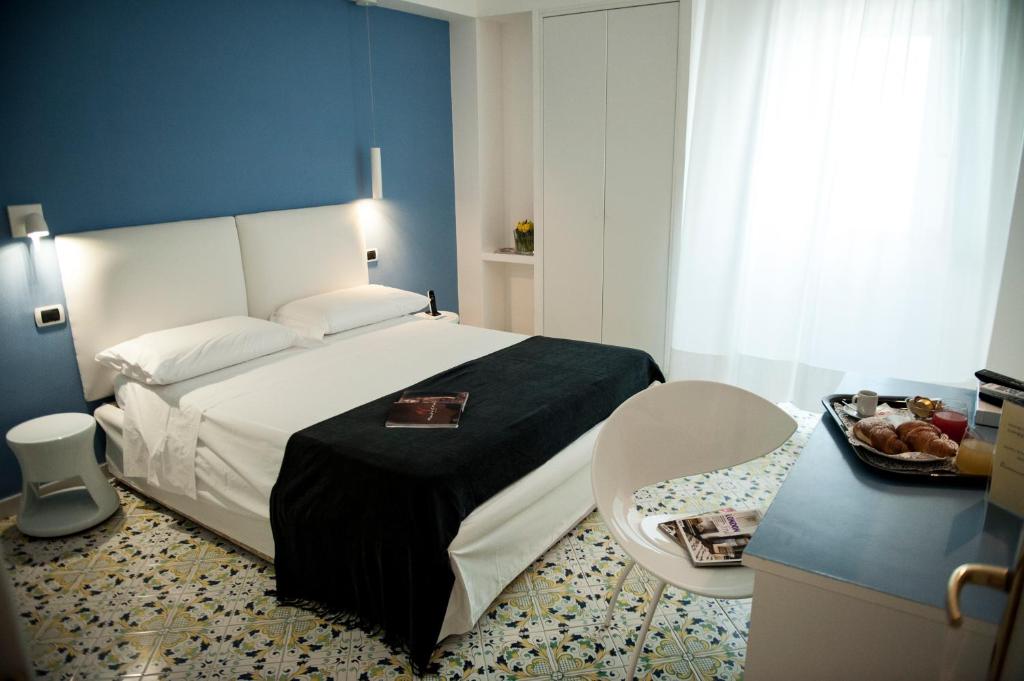 Кровать или кровати в номере Hotel Villa Felice Relais