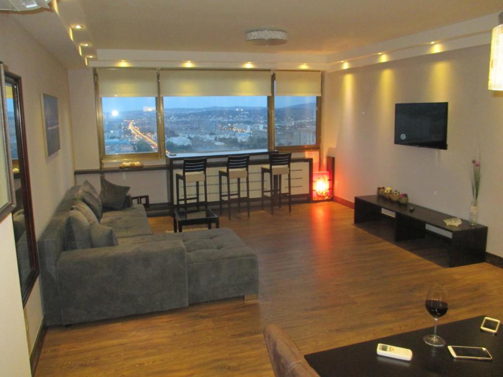 A seating area at Genex Apartment