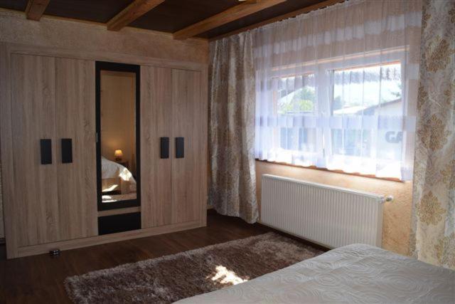 Łóżko lub łóżka w pokoju w obiekcie Apartamenty Bahus - Centrum