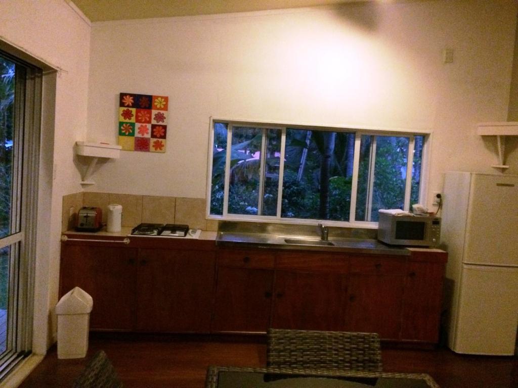 a kitchen with a sink and a window at Raina Holiday Accommodation in Rarotonga