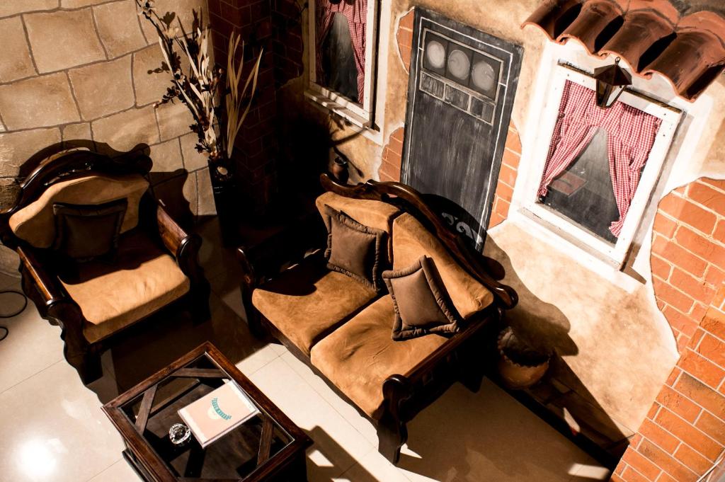 an overhead view of a living room with two chairs at Qantu Hotel in La Paz