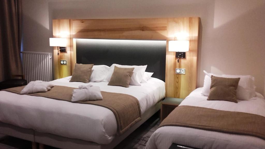 Postel nebo postele na pokoji v ubytování Hotel Le Cercle