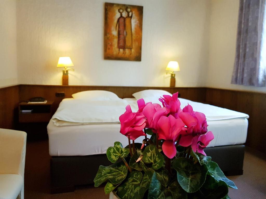 Postel nebo postele na pokoji v ubytování Hotel Restaurant Jägerhof