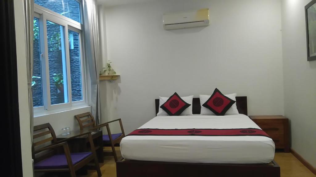 Postel nebo postele na pokoji v ubytování Green CoCo HomeStay