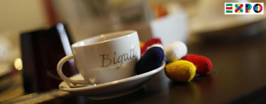 a table with a cup and some stuffed animals on it at Bigatt Bed & Breakfast in Vanzago