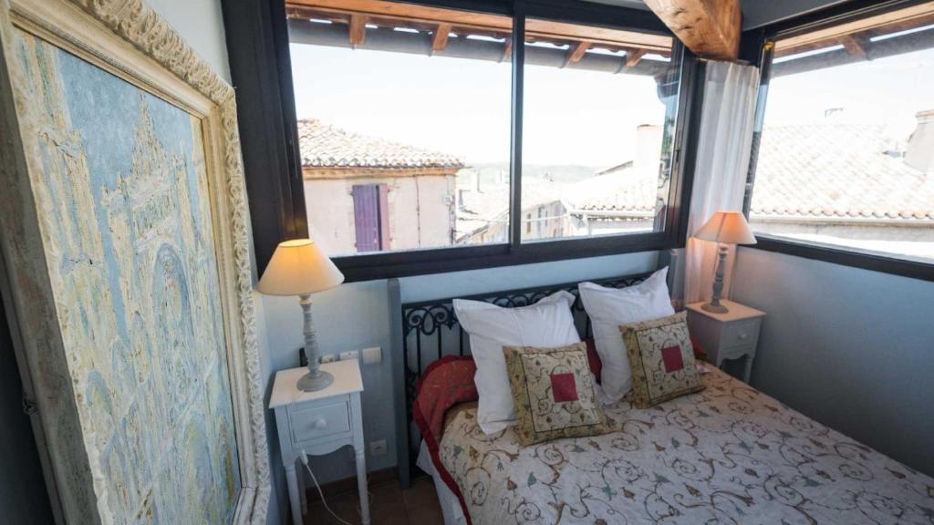 Postel nebo postele na pokoji v ubytování L'Ancienne Auberge