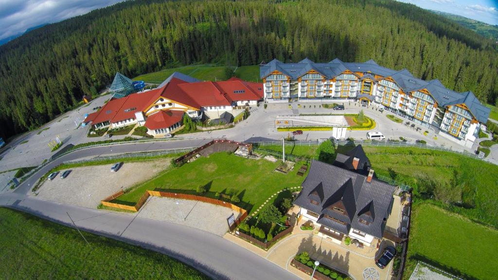 an aerial view of a resort with a large building at Śtadraj in Bukowina Tatrzańska