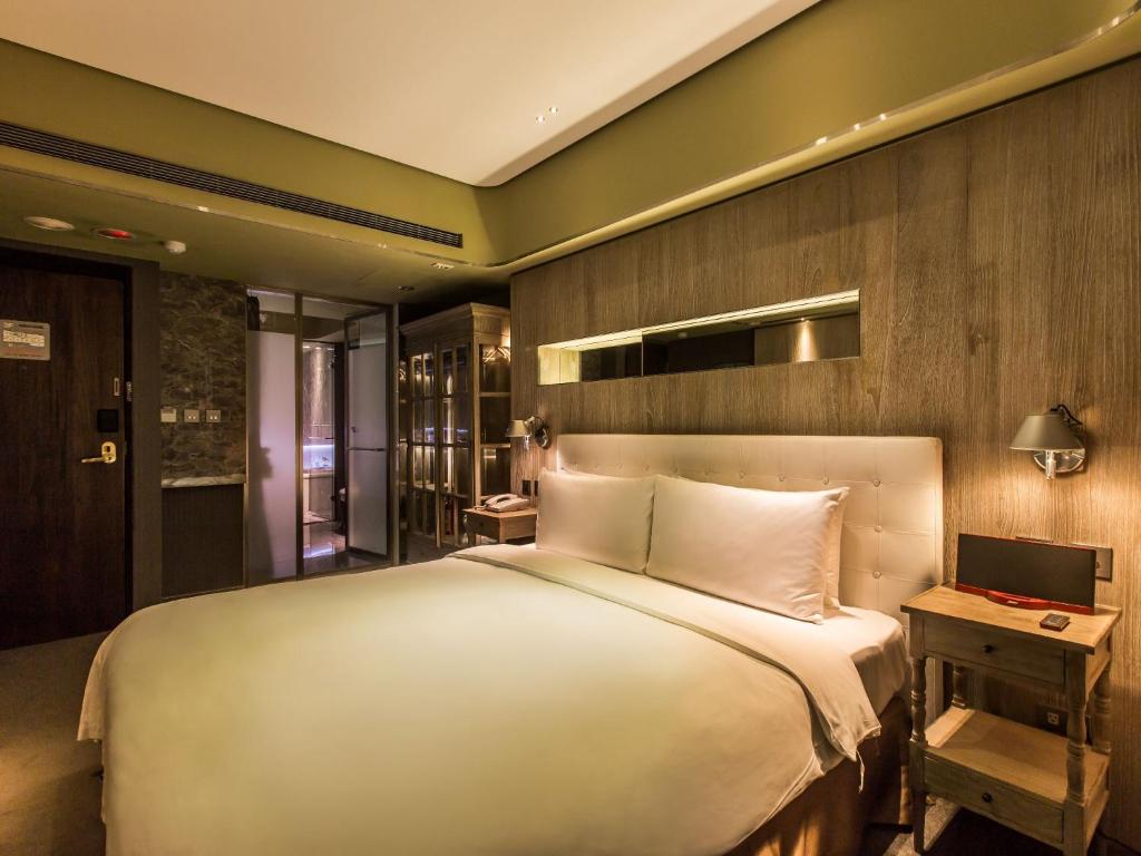 Postel nebo postele na pokoji v ubytování inhouse Hotel